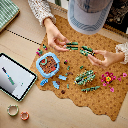 girl building flowering lego cactus