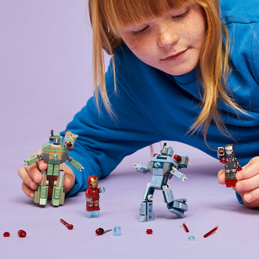 Young girl playing with LEGO action figures