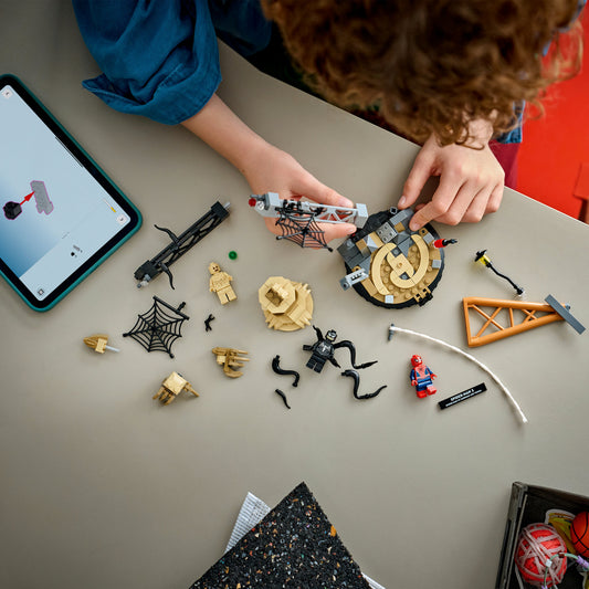 boy building lego marvel epic battle spiderman vs sandman