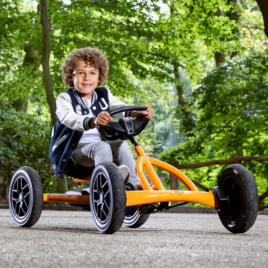 Lifestyle images of children riding the go-kart in various settings.