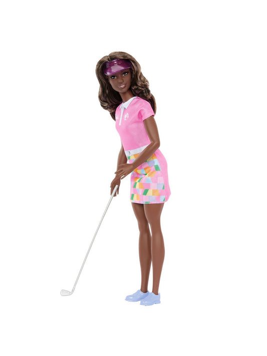 Barbie Golfer Doll swings into action, wearing her stylish pink skirt and matching visor.