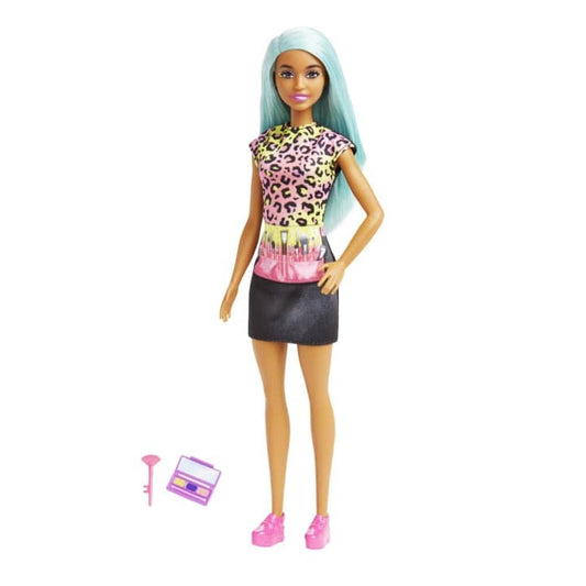 Barbie Makeup Artist Doll with Teal Hair, ready for makeovers with her stylish apron and beauty accessories.
