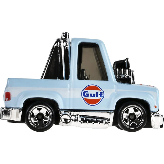 Hot Wheels Tooned '83 Chevy Silverado JCB84 in a dynamic pose, perfect for imaginative play and display.