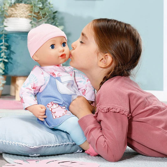 child kissing doll