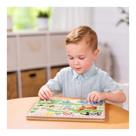 boy playing with sound puzzle at a table