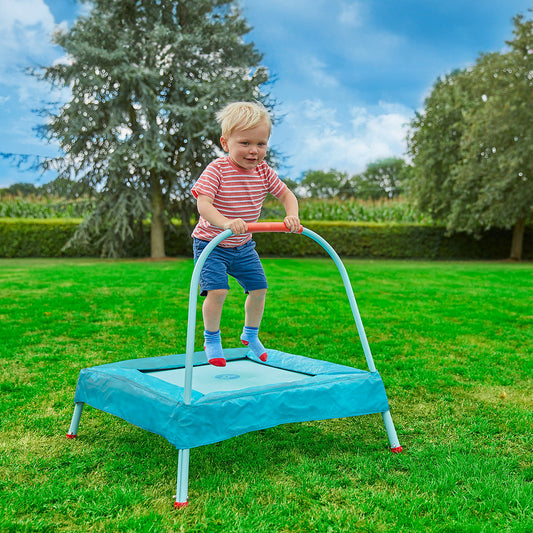 child bouncing on trampoline