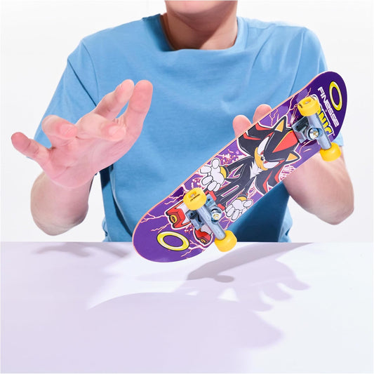 Child holding a colorful toy skateboard with cartoon characters on a white background