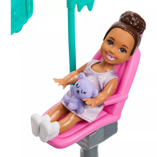 close up of little doll in chair with missing tooth