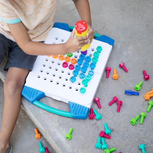 boy playing with design and drill kit
