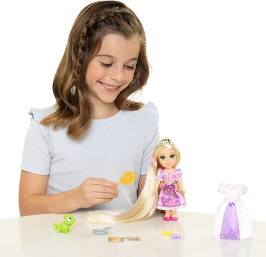 girl playing with rapunzel doll with long hair