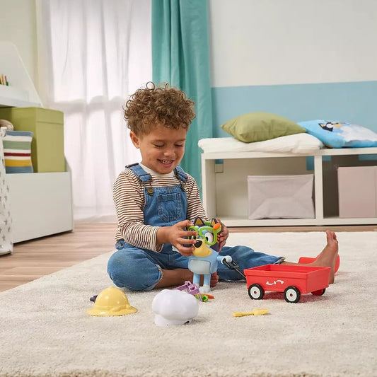 child playing with bluey doll