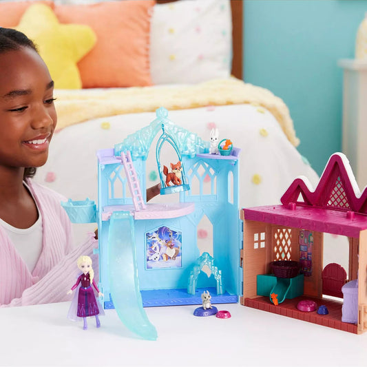 girl playing with frozen animal sanctuary playhouse
