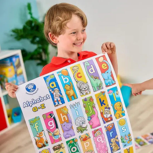 child holding alphabet sheet