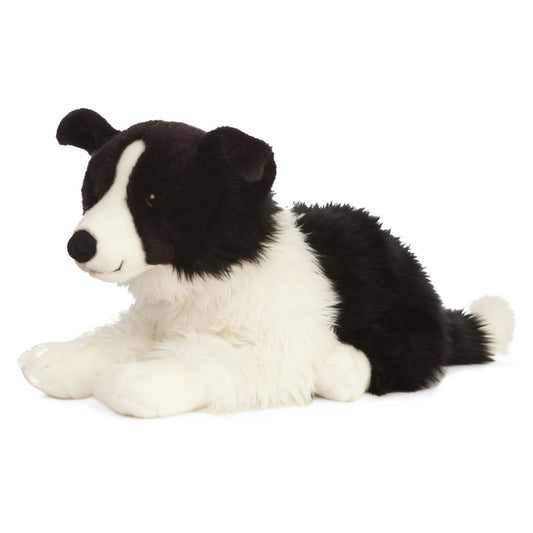 black and white plush dog
