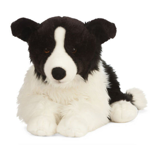black and white plush dog