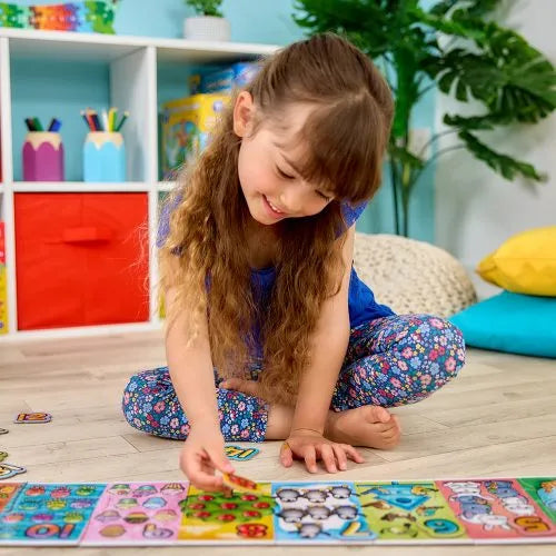 girl playing with a giant numbers puzzle