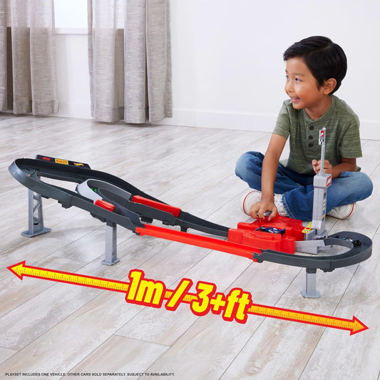 boy playing with racing track set