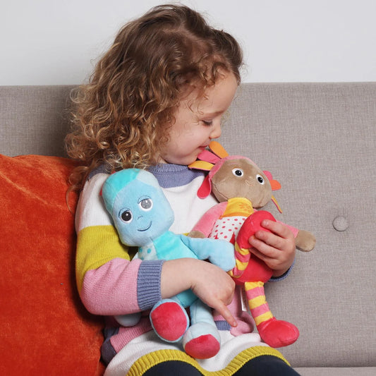 girl holding plush toys