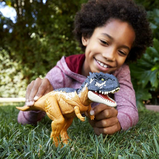 child playing with roar striker dinosaur