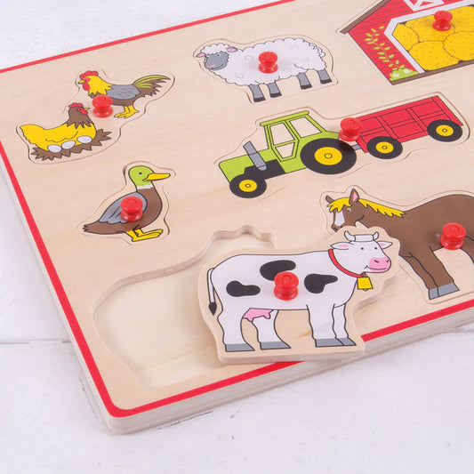 close up of wooden puzzle with cow peg witting on top