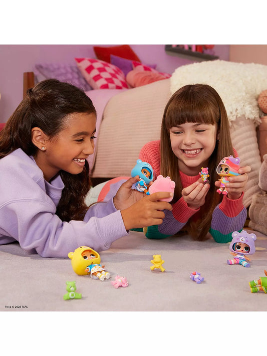 girls playing with carebear dolls