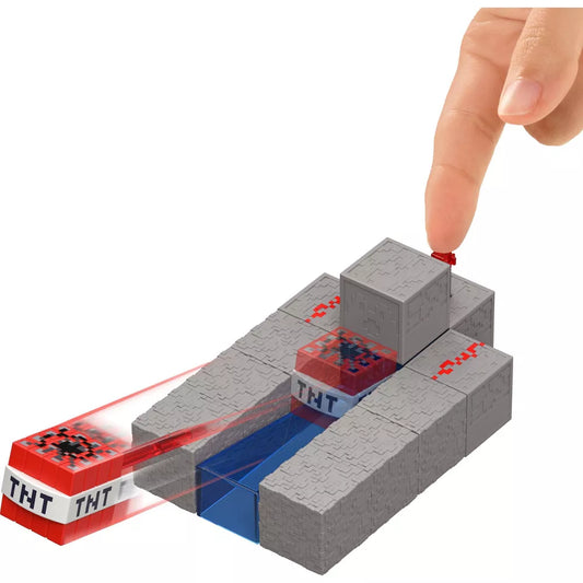 finger pressing button of tnt toy