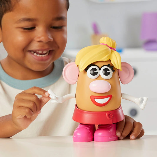 boy holding mrs potato head