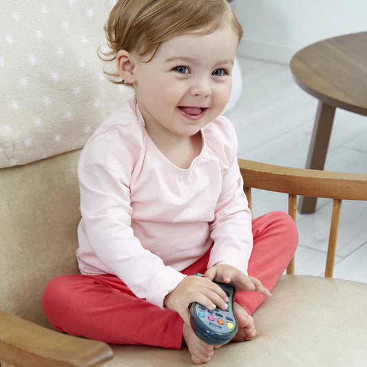 child playing with toy remote