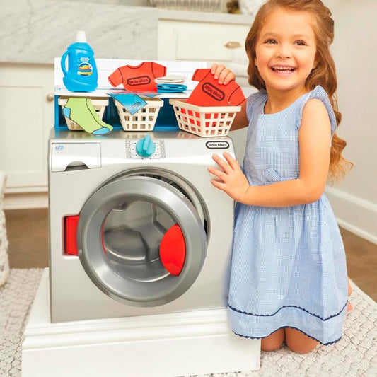 girl playing with little tikes washing machine