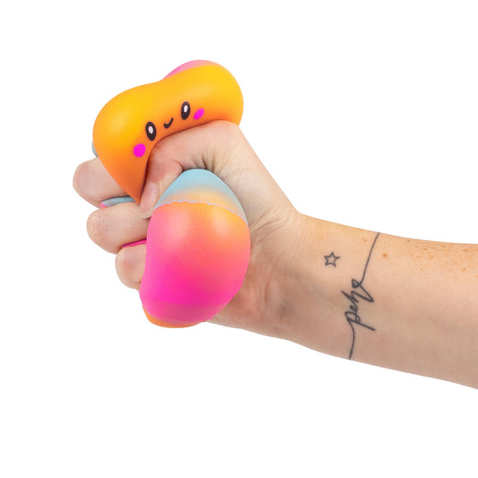 hand squishing marshmallow squishy toy