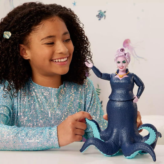 girl playing with ursula doll