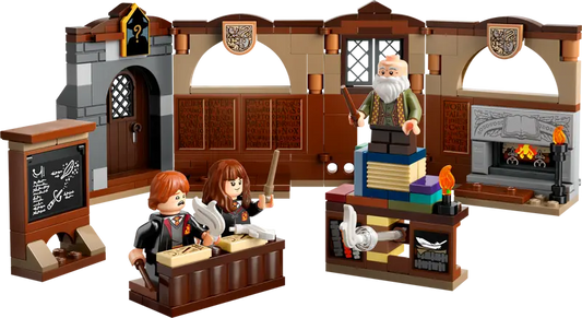 Close-up of Ron Weasley and Hermione Granger practicing spells in the classroom.