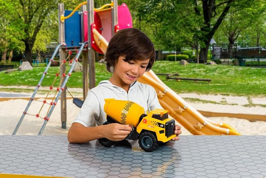 child playing with construction truck