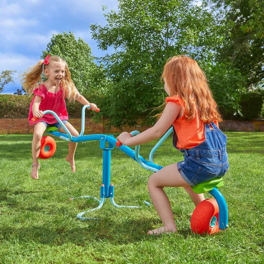 Children playing on the spiro spin seesaw