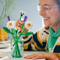 girl playing with lego daisies 