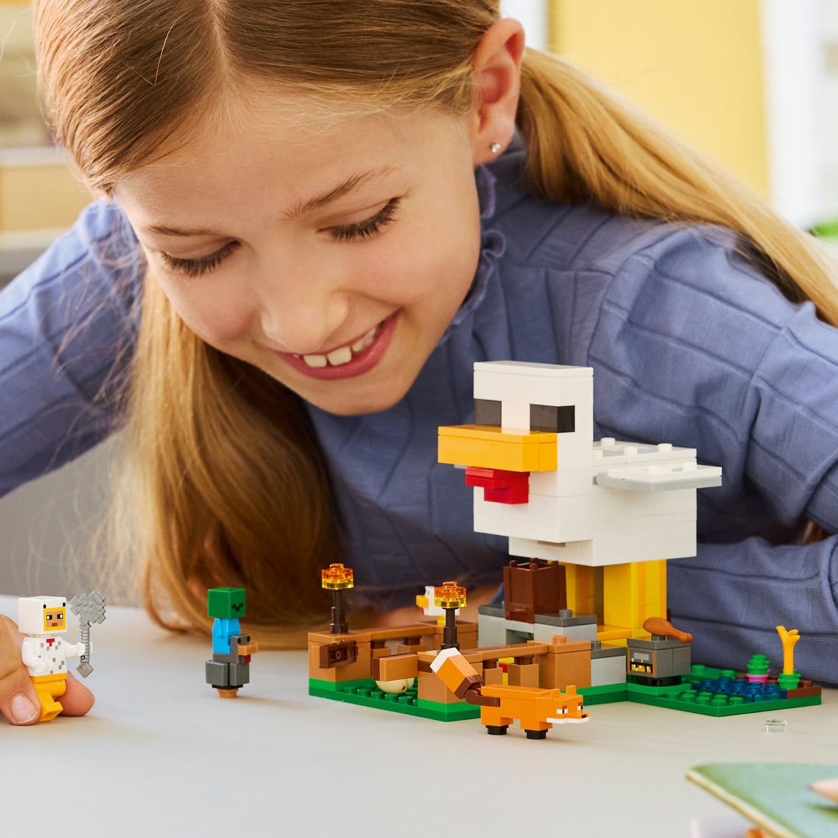 girl playing with lego minecraft chicken farm 