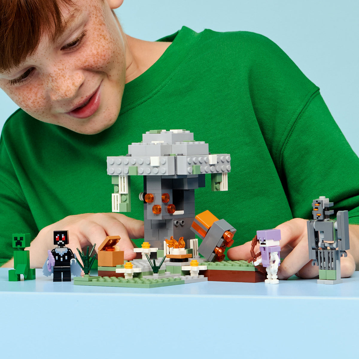 boy playing with lego minecraft the pale garden 