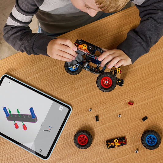 boy building lego monster jam grave digger fire and ice 