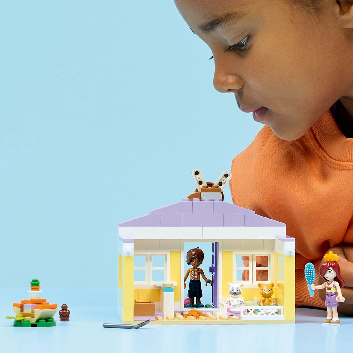 child playing with lego bunny hotel 