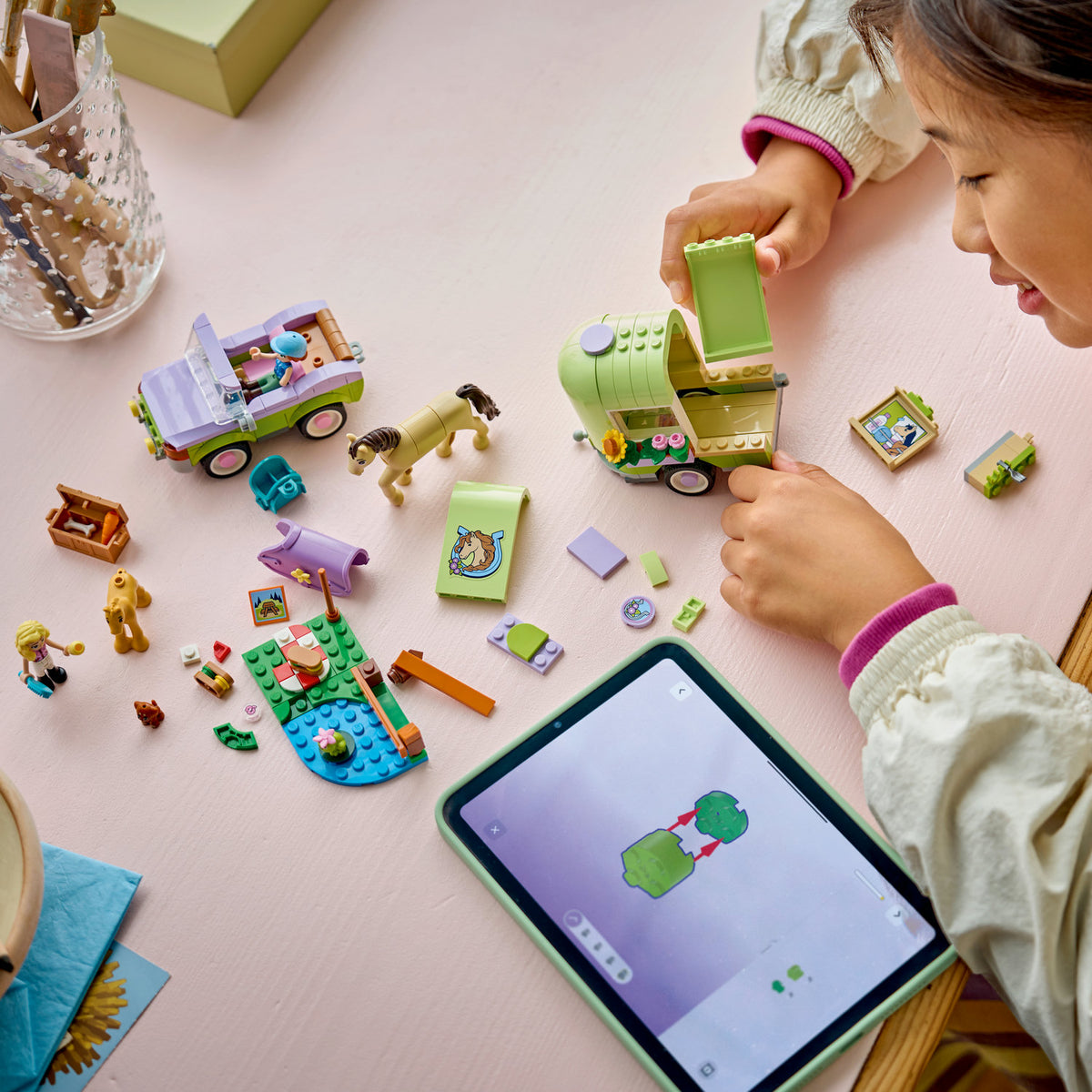 girl building lego friends horse and baby foal trailer 