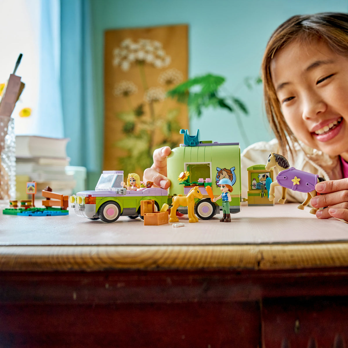 girl playing with lego friends horse and baby foal trailer 