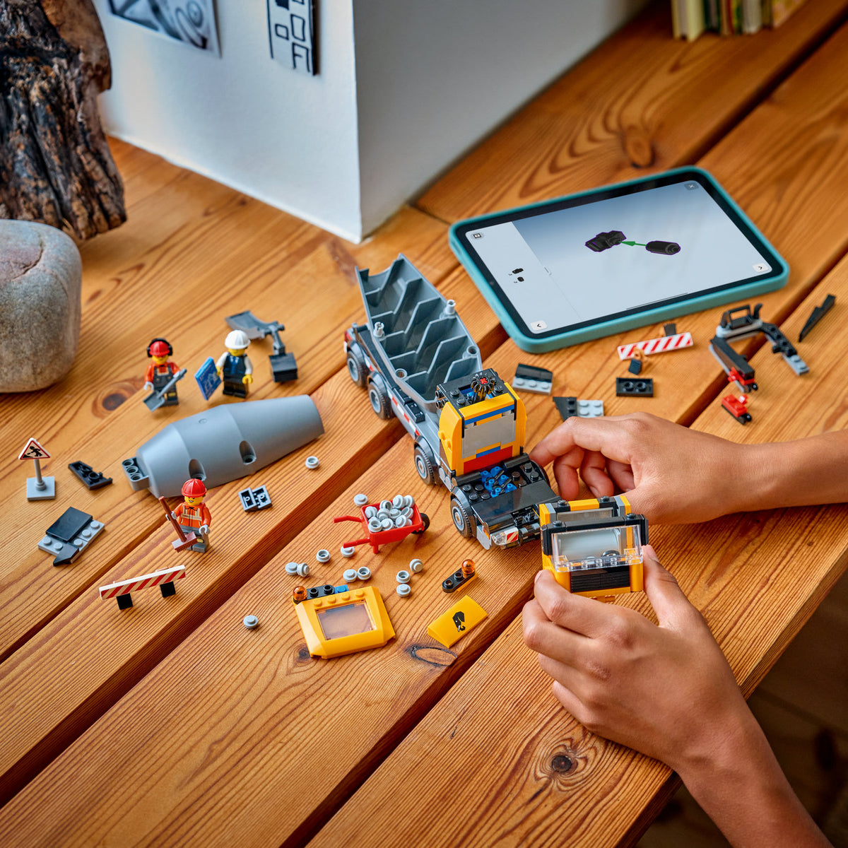 boy building lego city cement mixer 