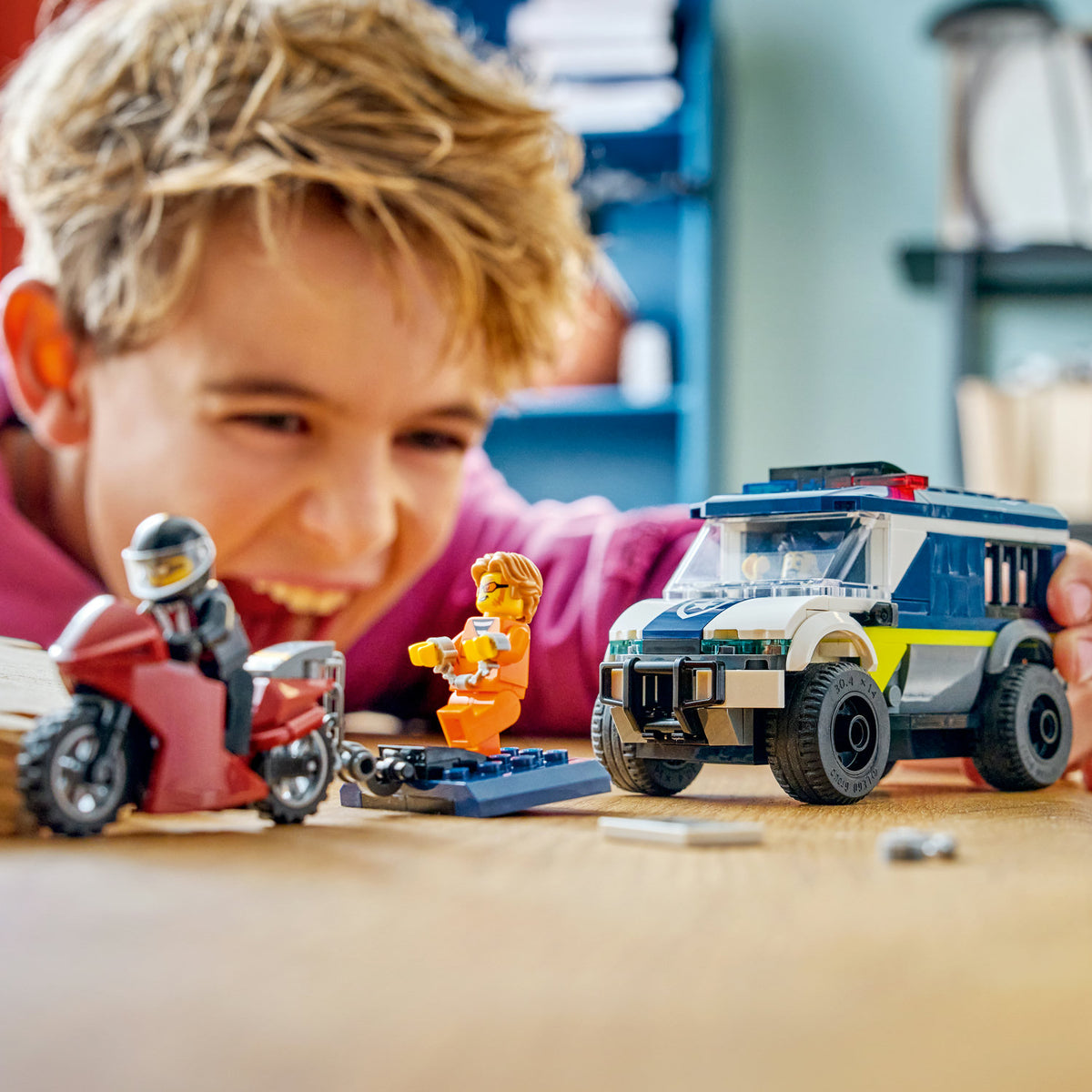 boy playing with lego city police prisoner transport van 