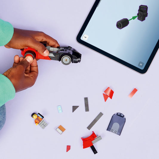 boy building lego city ev supercar 