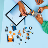 boy building motorcycle transport set 