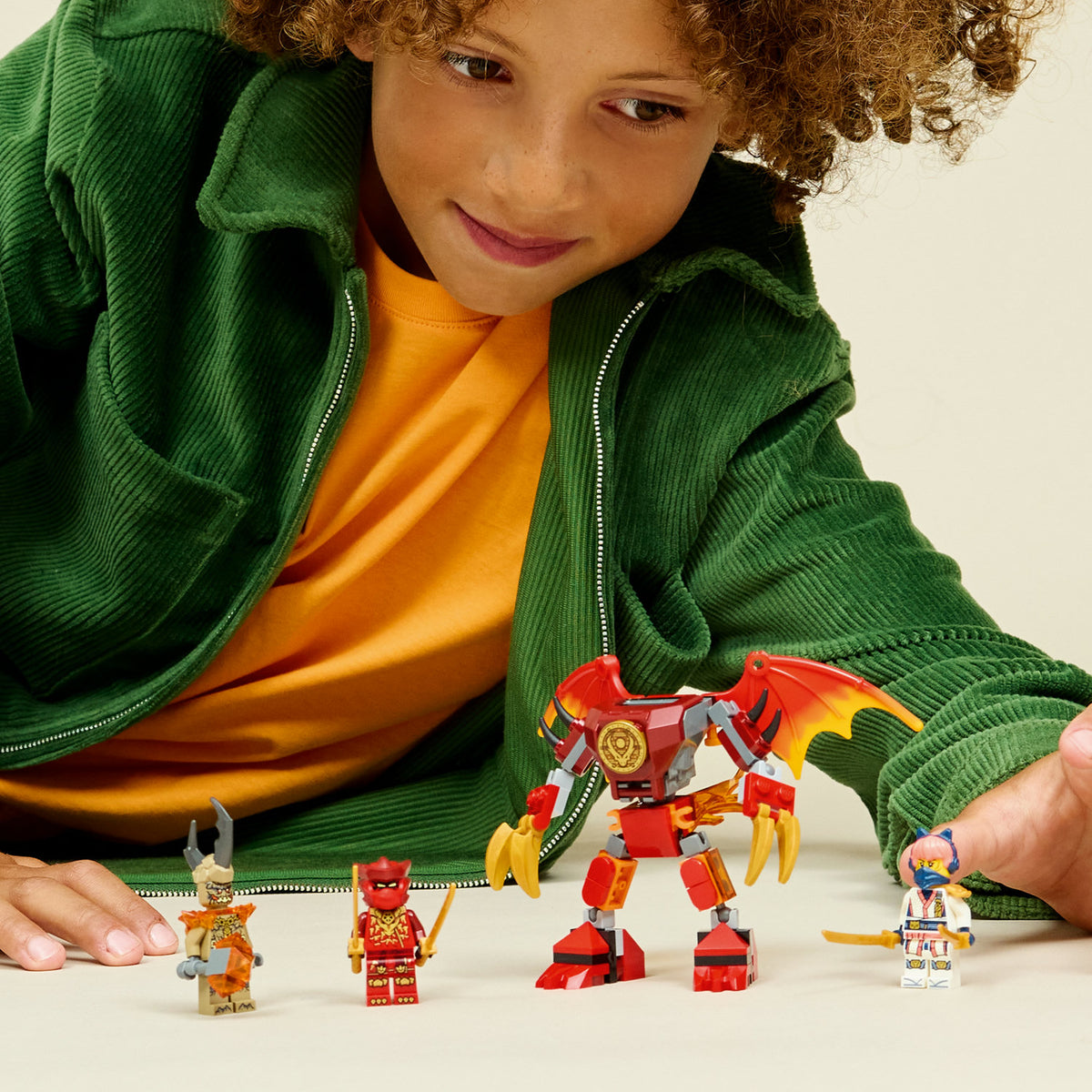 boy playing with lego kais dragon mechbattle pack 