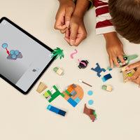 boy building grogus homestead lego set 