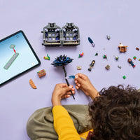 birds eye view of young child building black dahlia flower LEGO 