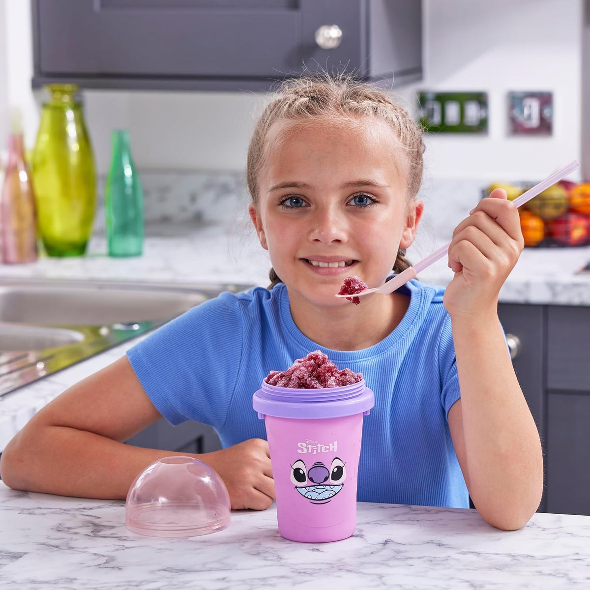 ChillFactor Disney Stitch Angel Slushy Maker Pink – child eating a slushy
