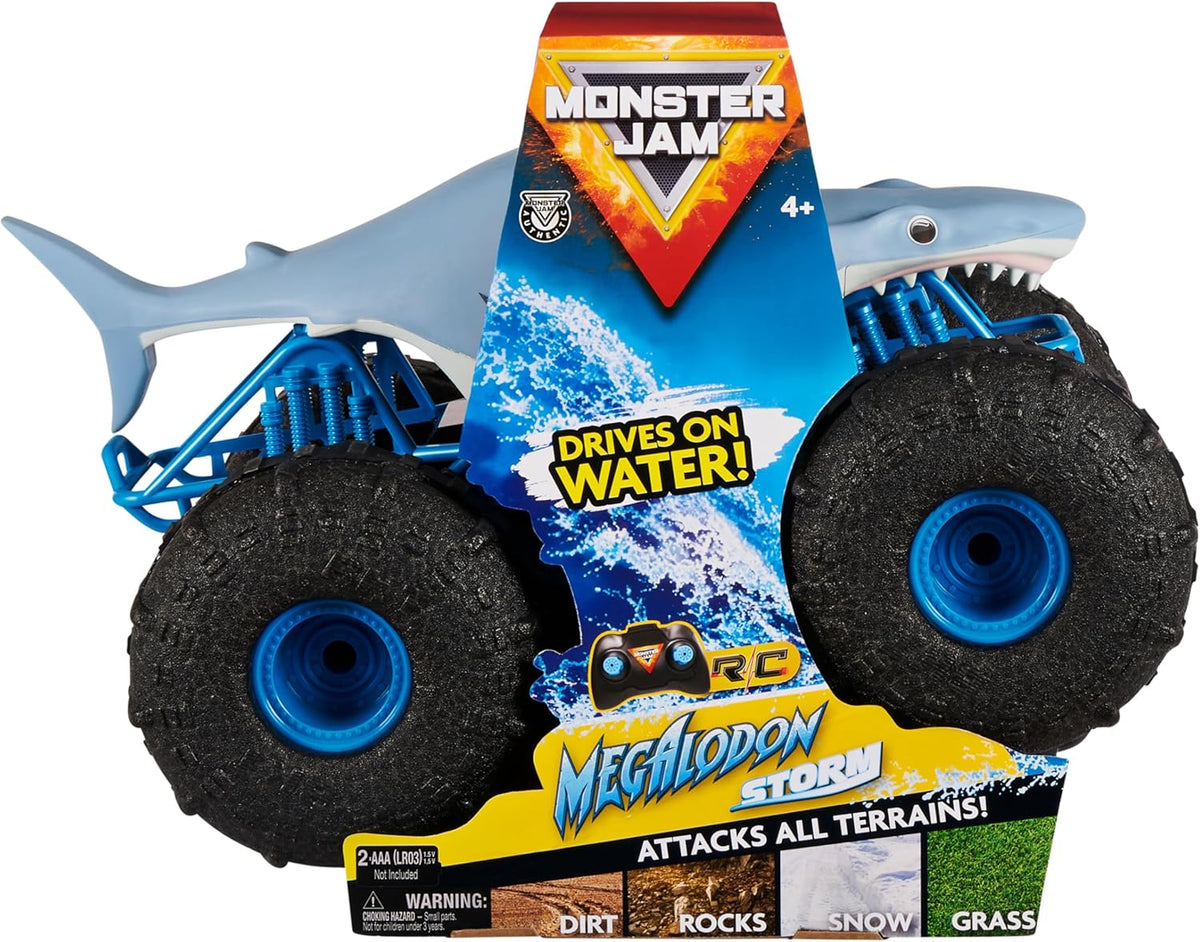 Toy monster truck with shark design and 'Monster Jam' branding on packaging